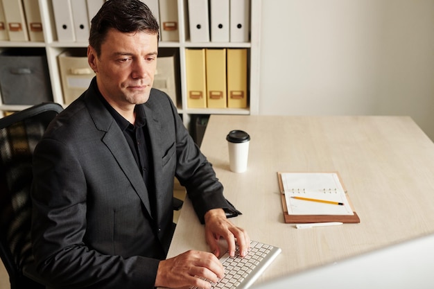 Businessman Checking Emails on Computer