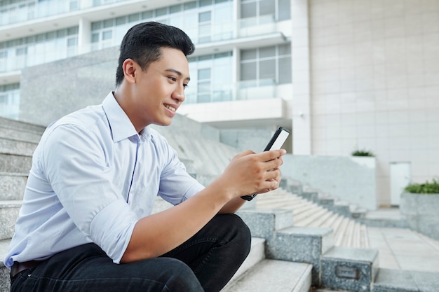 Businessman checking text messages