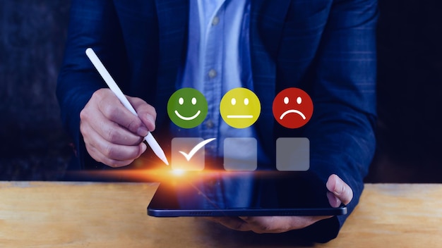 Businessman choosing happy smile face icon feedback rating and positive customer review experience satisfaction survey mental health assessment World mental health day concept