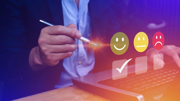 Businessman choosing happy smile face icon feedback rating and positive customer review experience satisfaction survey mental health assessment World mental health day concept