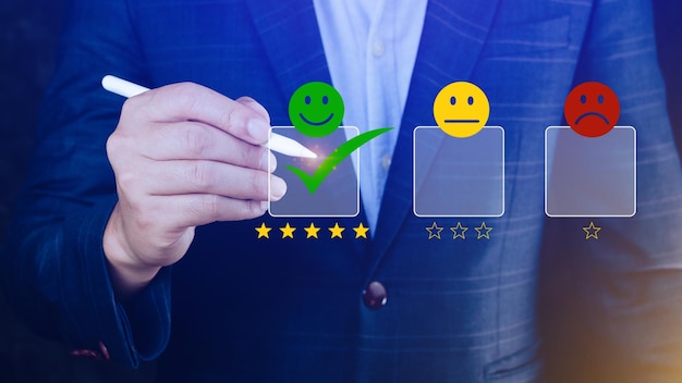 Businessman choosing happy smile face icon feedback rating and positive customer review experience satisfaction survey mental health assessment