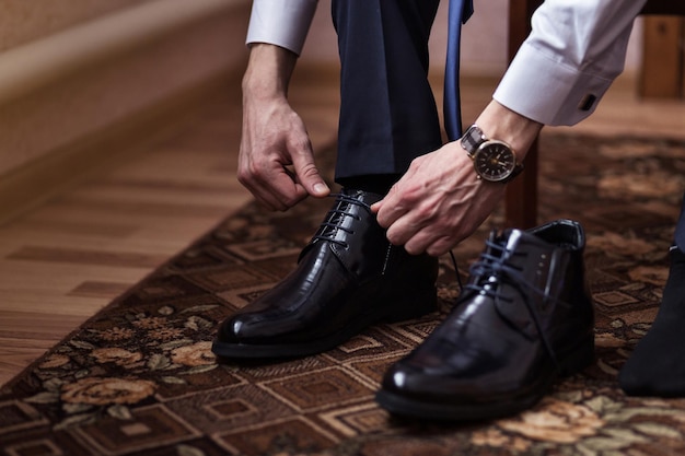 Businessman clothes shoes man getting ready for workgroom morning before wedding ceremony