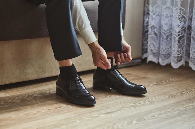 Businessman clothes shoes man getting ready for workgroom morning before wedding ceremony