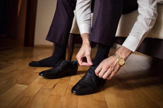 Businessman clothes shoes man getting ready for workgroom morning before wedding ceremony