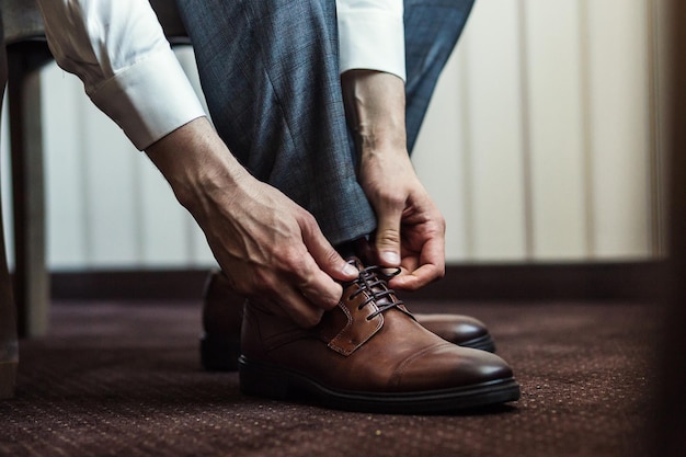 Businessman clothes shoes man getting ready for workgroom morning before wedding ceremony