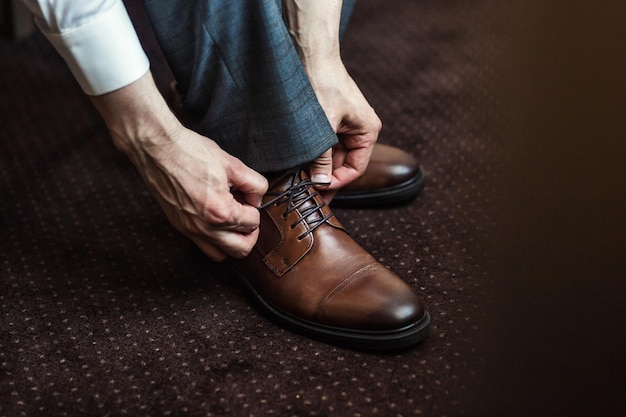 Businessman clothes shoes man getting ready for workgroom morning before wedding ceremony