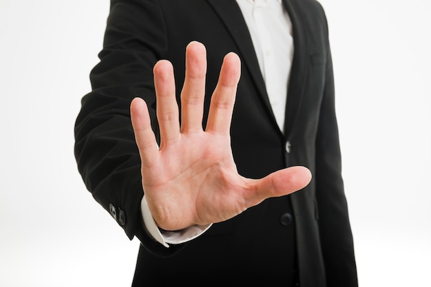 Businessman doing stop gesture