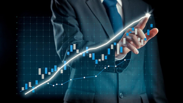 Businessman draw finance allusive graph chart showing business profit growth