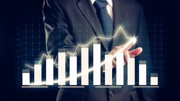 Businessman draw finance allusive graph chart showing business profit growth