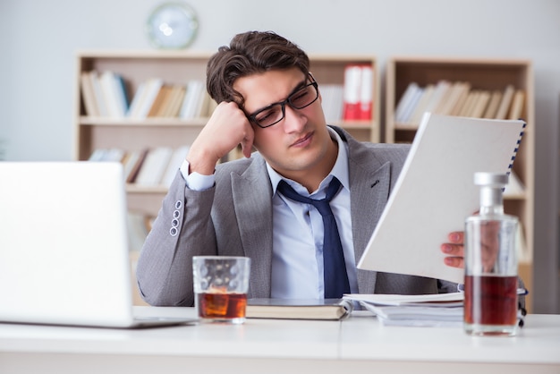 Businessman drinking in the office