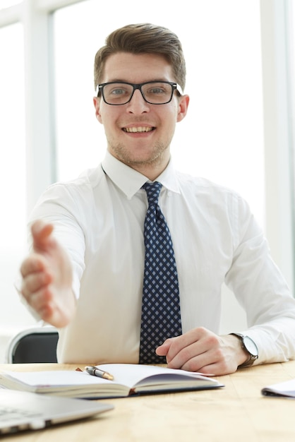 Businessman extending hand to shake