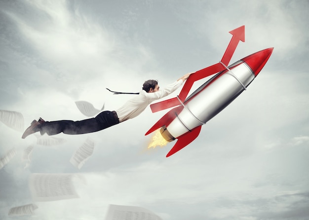 Businessman flying attached to a missile with an arrow. take-off business success concept  . 3D Rendering