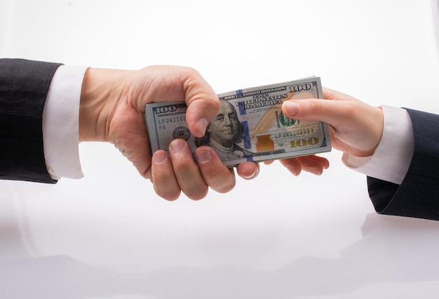 Businessman giving and receiving dollar banknote money