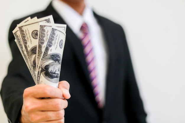 Businessman hand holding money