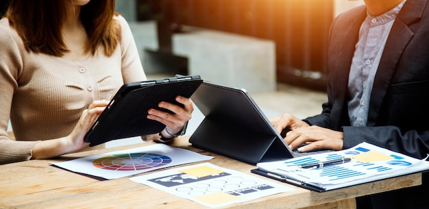 Businessman hand working digital marketing media in virtual screen with mobile phone and modern compute with VR icon diagram at office in morning light