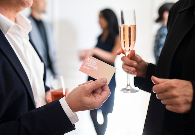 Businessman handing over a business card mockup