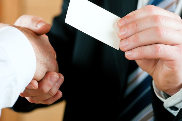 Businessman handing over business card