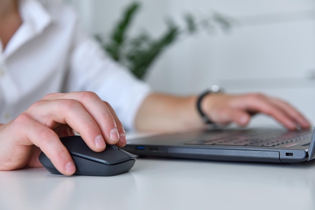 Businessman hands pressing keys of laptop