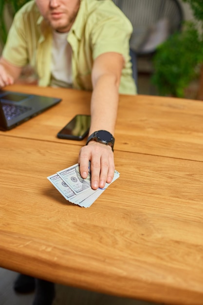 Businessman hands take cash american dollars banknotes