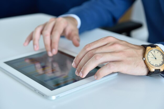 Businessman hands using digital tablet