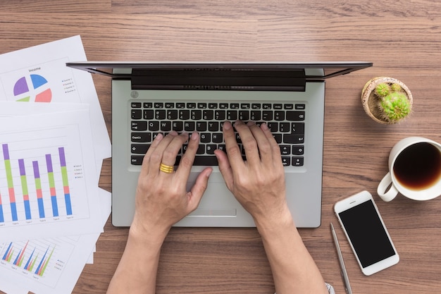 businessman hands using laptop computer on desk