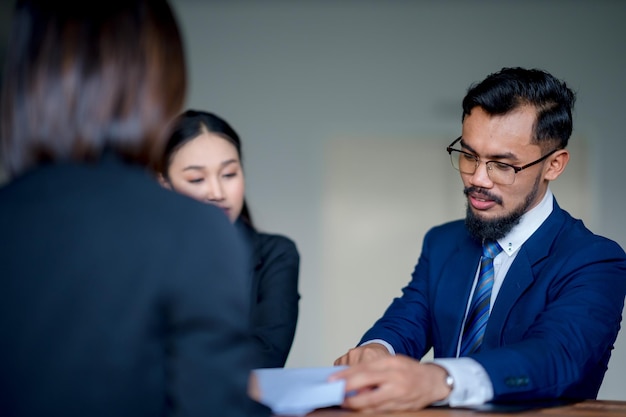 Businessman having a meeting with executives