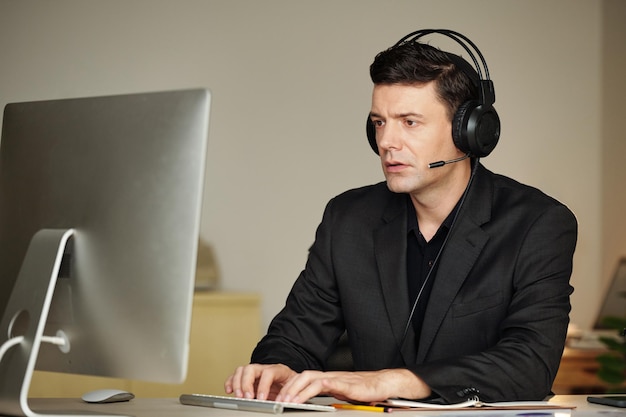 Businessman in Headset Working