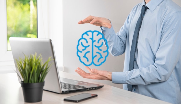 Businessman holding abstract brain and icon tools, device, customer network connection communication on virtual , innovative development future technology, science, innovation and business concept.