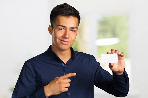 Businessman holding a blank signboard