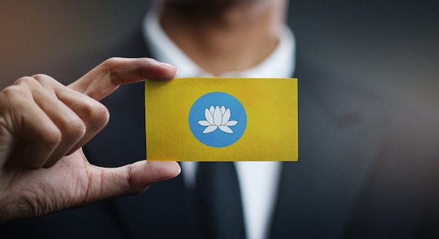 Businessman Holding Card of Kalmykia Flag