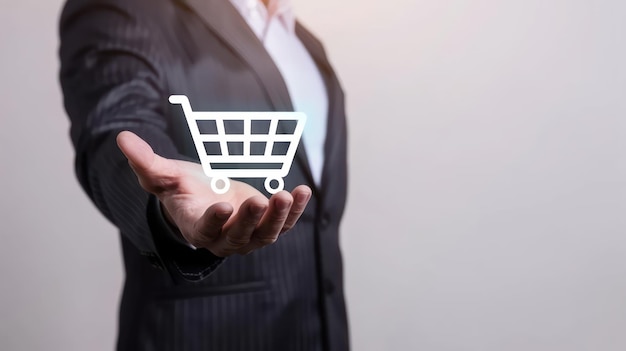 Photo businessman holding digital shopping cart icon on white background representing online shopping and e commerce