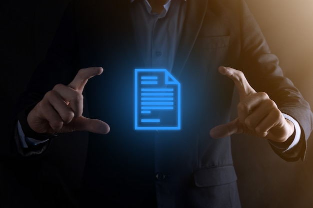 Businessman holding a document icon in his hand