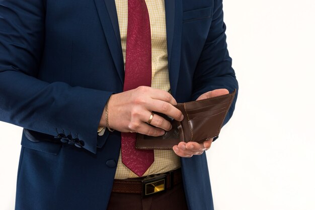 Businessman holding an empty wallet