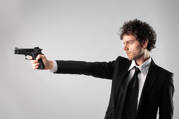 Businessman holding a gun