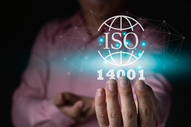 A businessman holding the ISO 14001 environment icon graphic light internet global icon standard quality document control for organization and industry management products copy space for text