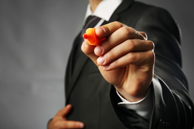 Businessman holding marker