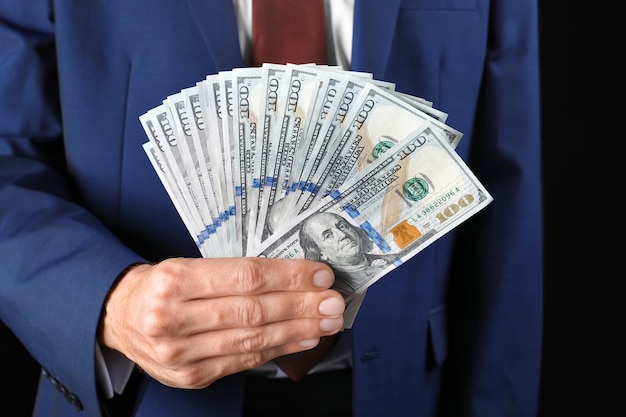 Businessman holding money closeup Corruption concept