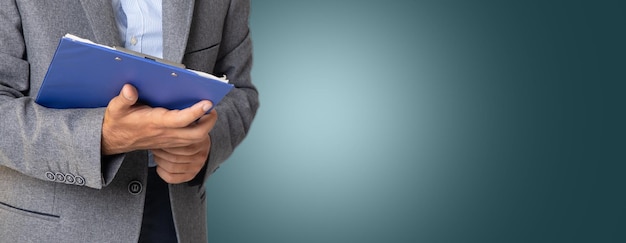 Businessman holding a paper tablet in his hand