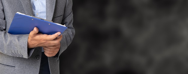 Businessman holding a paper tablet