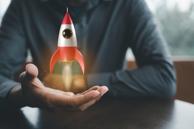 Businessman holding rocket 3D icon on hand