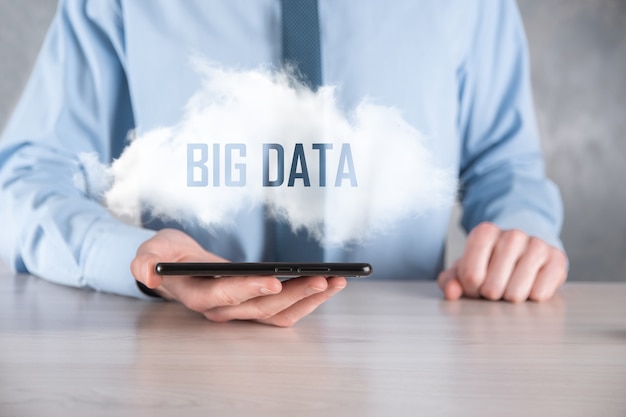 Businessman holds the inscription BIG DATA