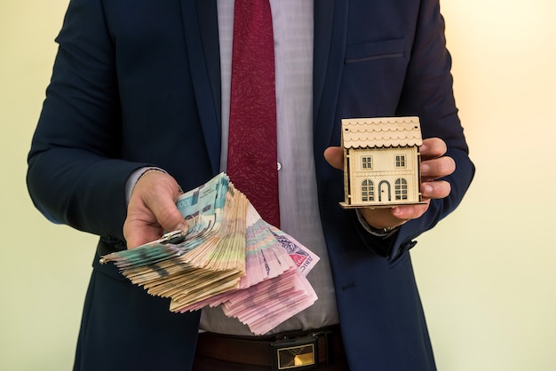 Businessman holds the keys to the apartment