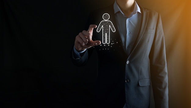 Businessman holds man person icon on dark tone background.HR Human ,people iconTechnology Process System Business with Recruitment, Hiring, Team Building. Organisation structure concept