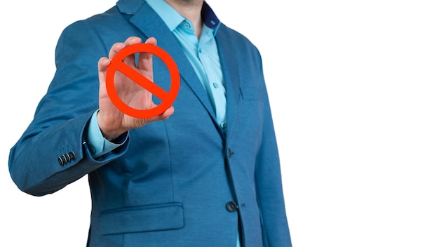 Businessman holds a red NO prohibition symbol