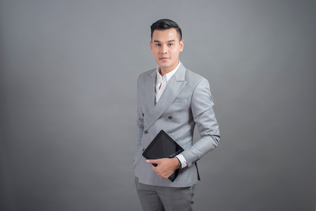 Businessman is holding tablet