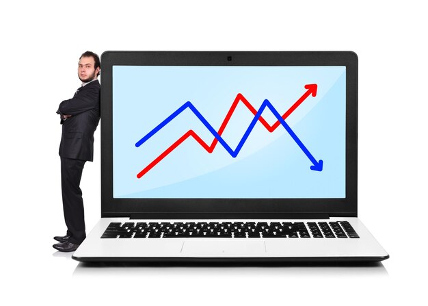 Businessman and laptop with chart