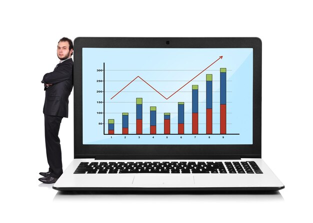 Businessman and laptop with chart