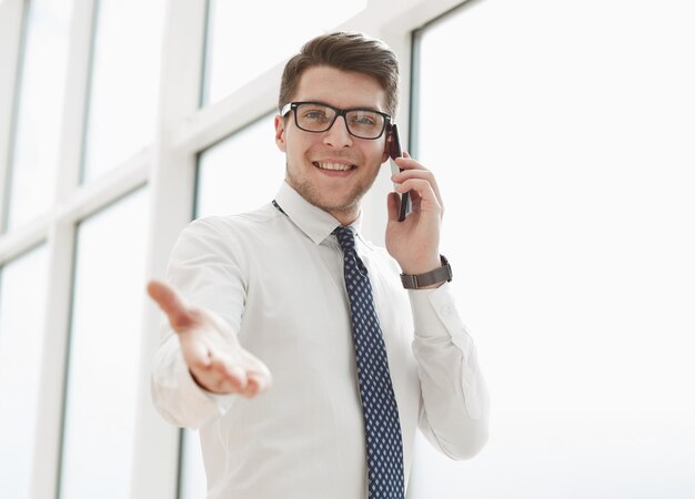 Businessman Making Phone Call In modern light Office