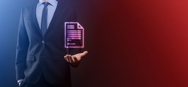 Businessman man holding a document icon in his hand Document Management Data System Business Internet Technology Concept. Corporate data management system DMS