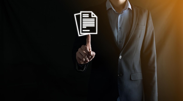 Businessman man holding a document icon in his hand Document Management Data System Business Internet Technology Concept Corporate data management system DMS